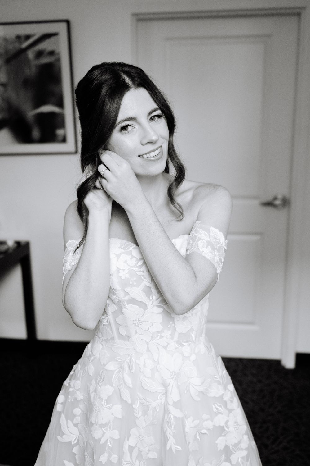 A series of black and white photos showing someone in a white lace dress posing playfully against a light background.