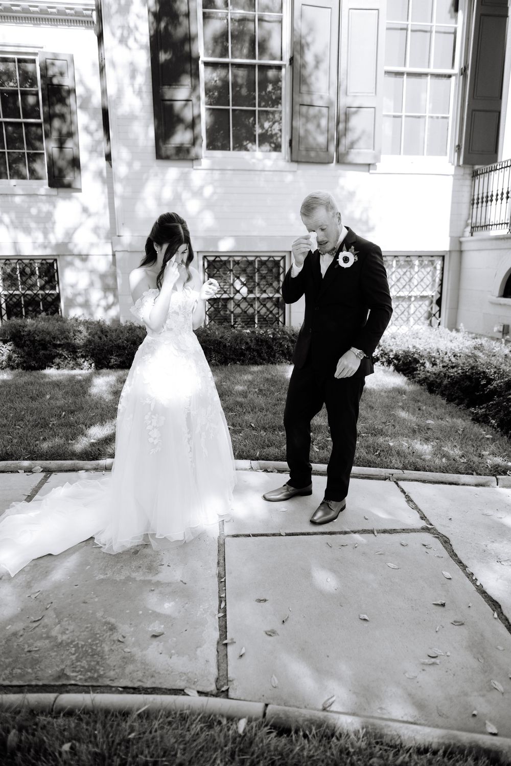 Black and white wedding photo sequence showing couple on sidewalk in front of house with white columns.