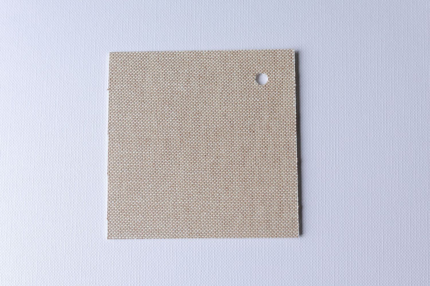 A square piece of olive green fabric or material against a white background.