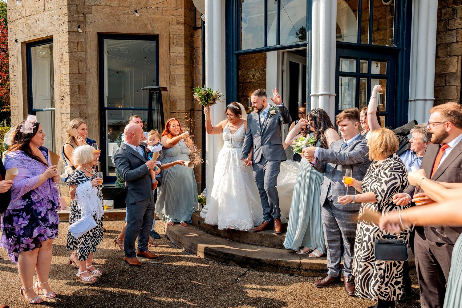 Unobtrusive wedding photography during a wedding exit.