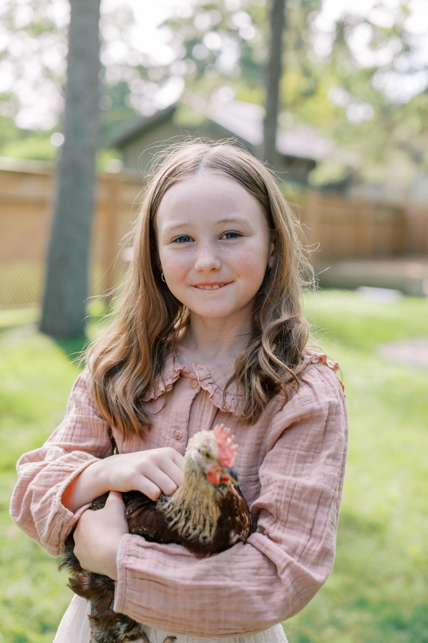 Young person in pink plaid shirt makes silly faces in a series of four outdoor portrait photos.