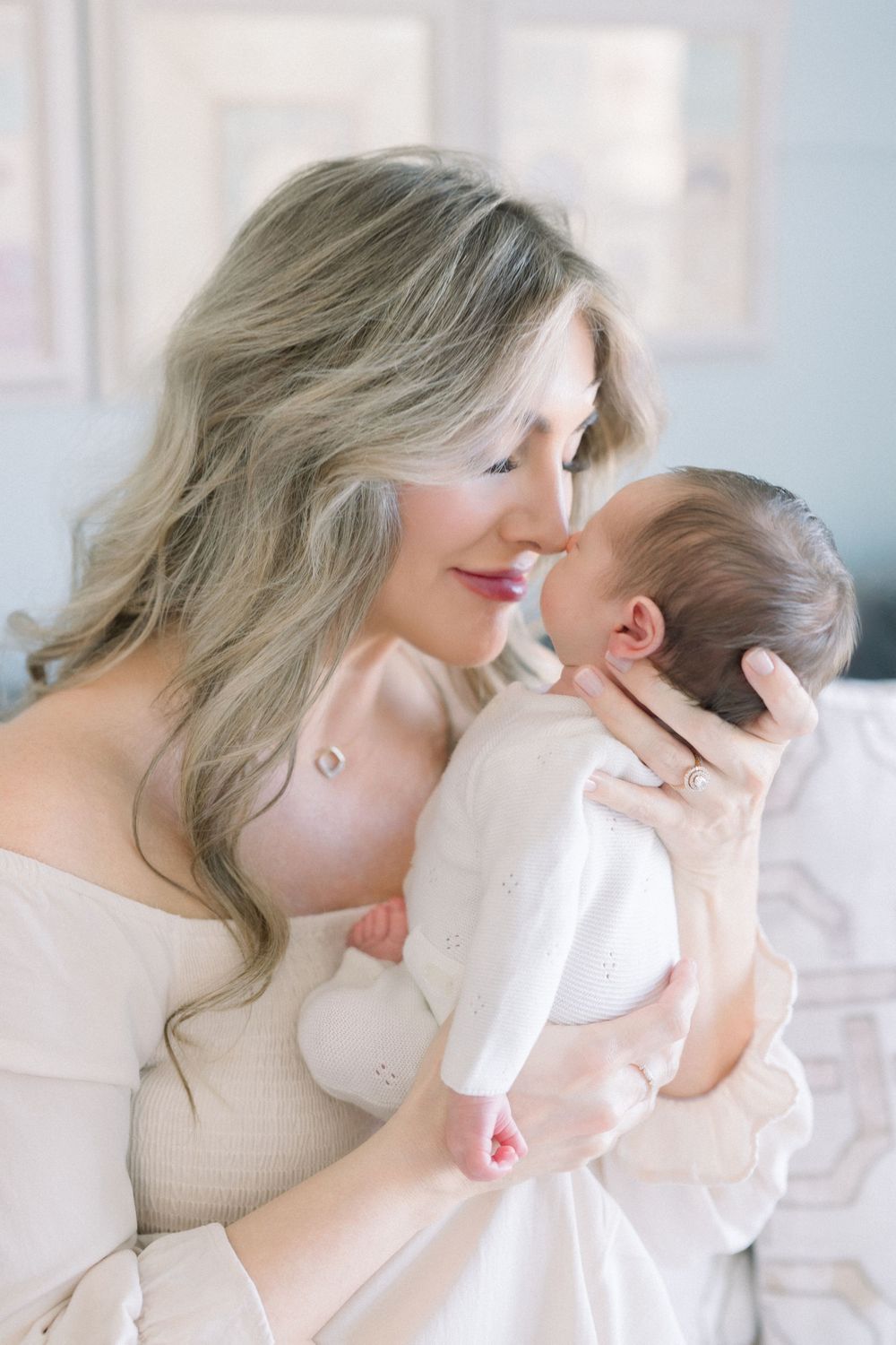 a mother and baby's noses touching at their in-home northern virginia newborn session