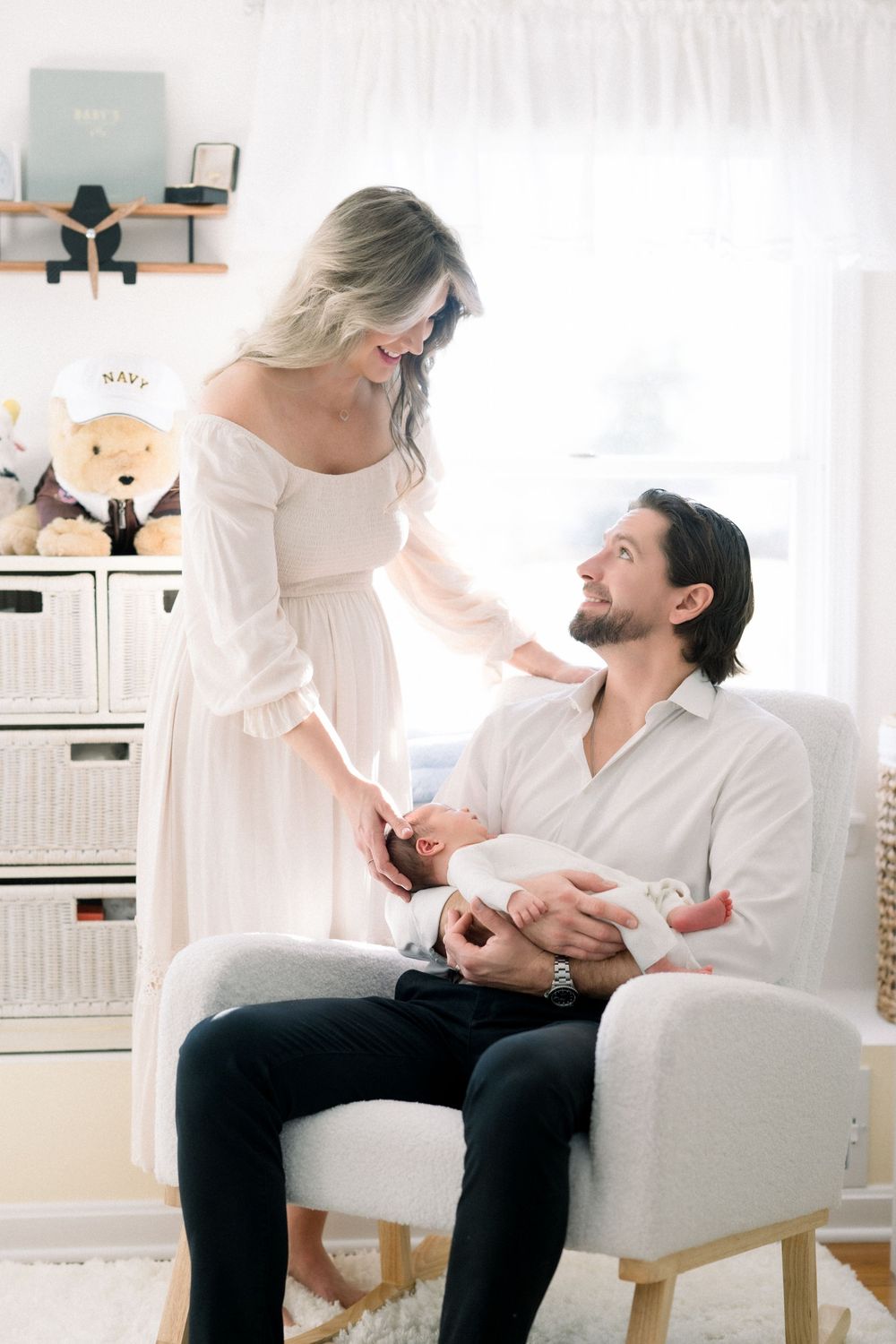 A couple shares a tender moment together taken by a DC Newborn Photographer