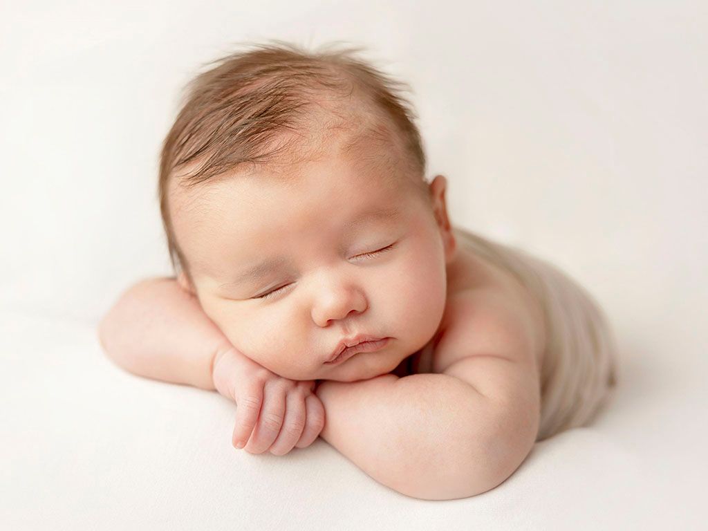 Sleeping newborn during photo studio session in Clear Lake