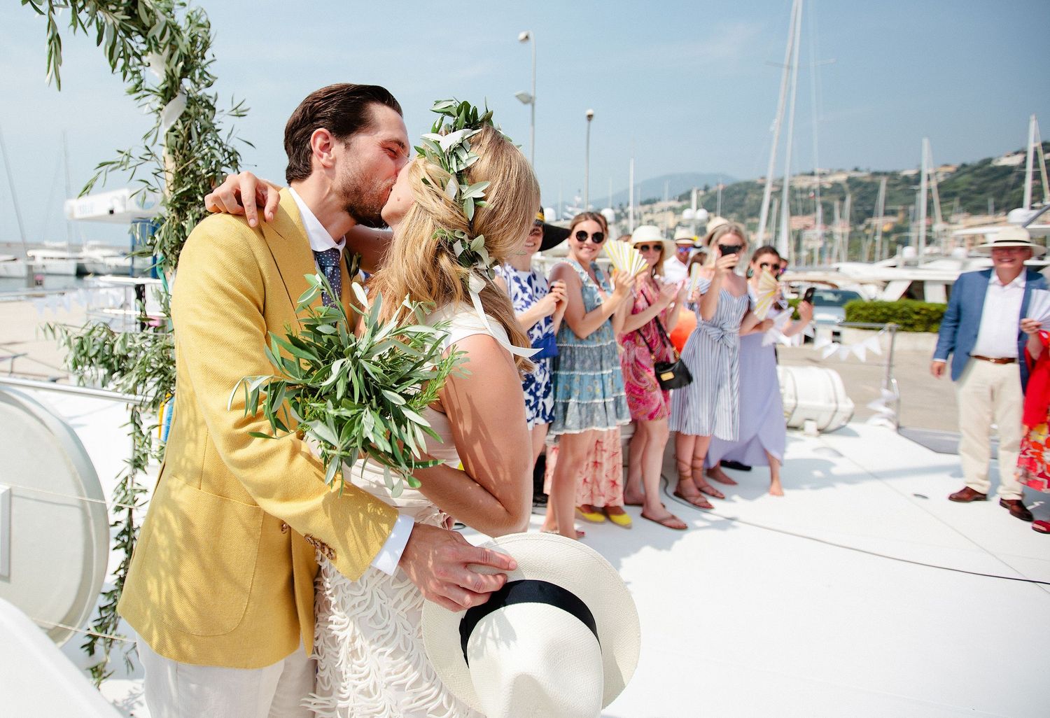 Couple kissing at a Catamaran Wedding in the Bay of Villefranche-sur-Mer in the french riviera