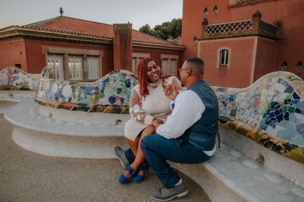 Loving embrace near colorful ceramic bench Park Güell Anniversary photoshoot Barcelona BarcelonaLoversPH