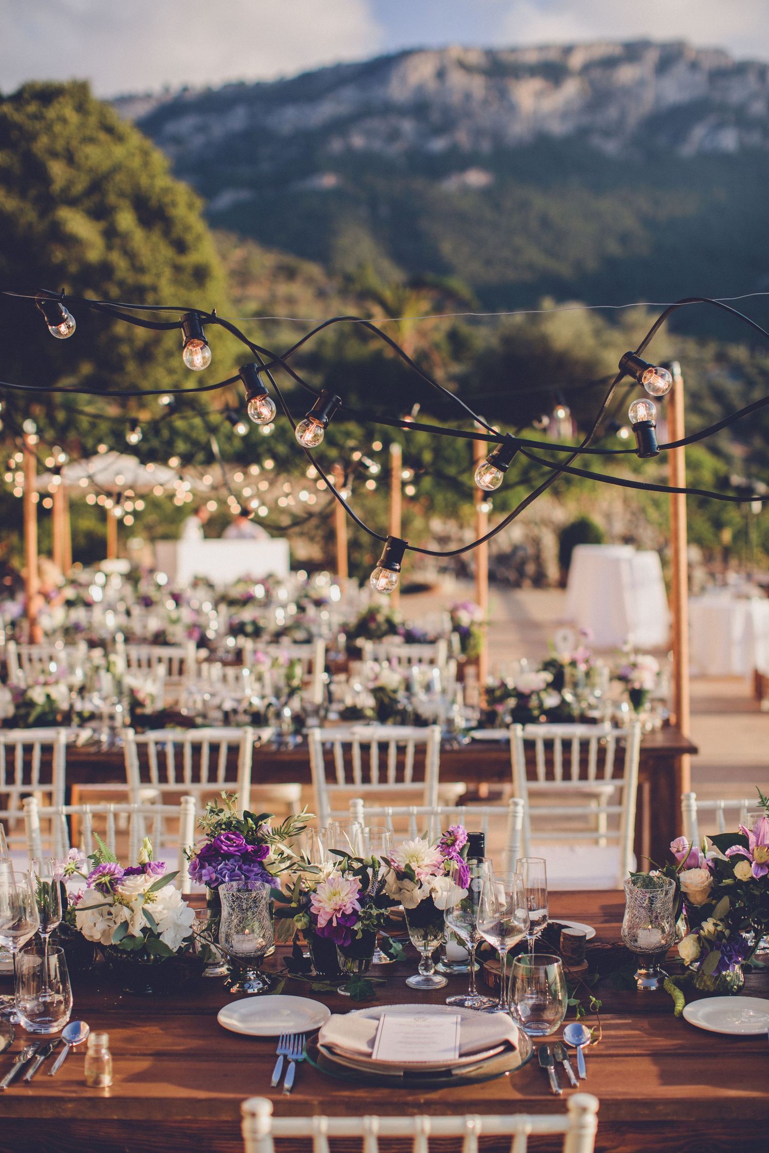 Outdoor wedding dinner setup at Son Marroig Mallorca overlooking the Tramuntana mountains