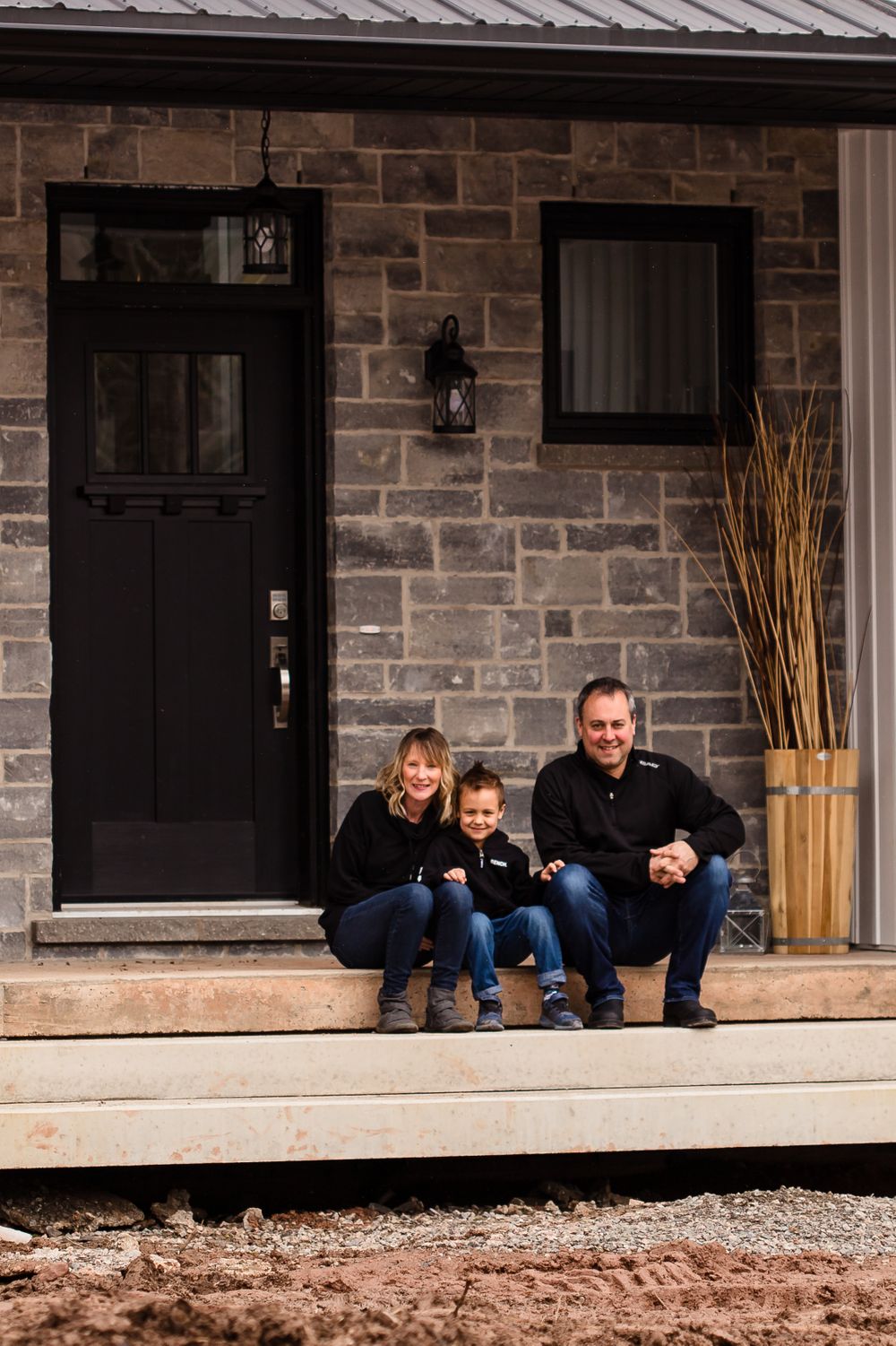 Family poses playfully on a stone porch in a progressive photo sequence.