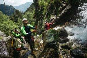 Expedition photographer captures guided rappel in canyoning