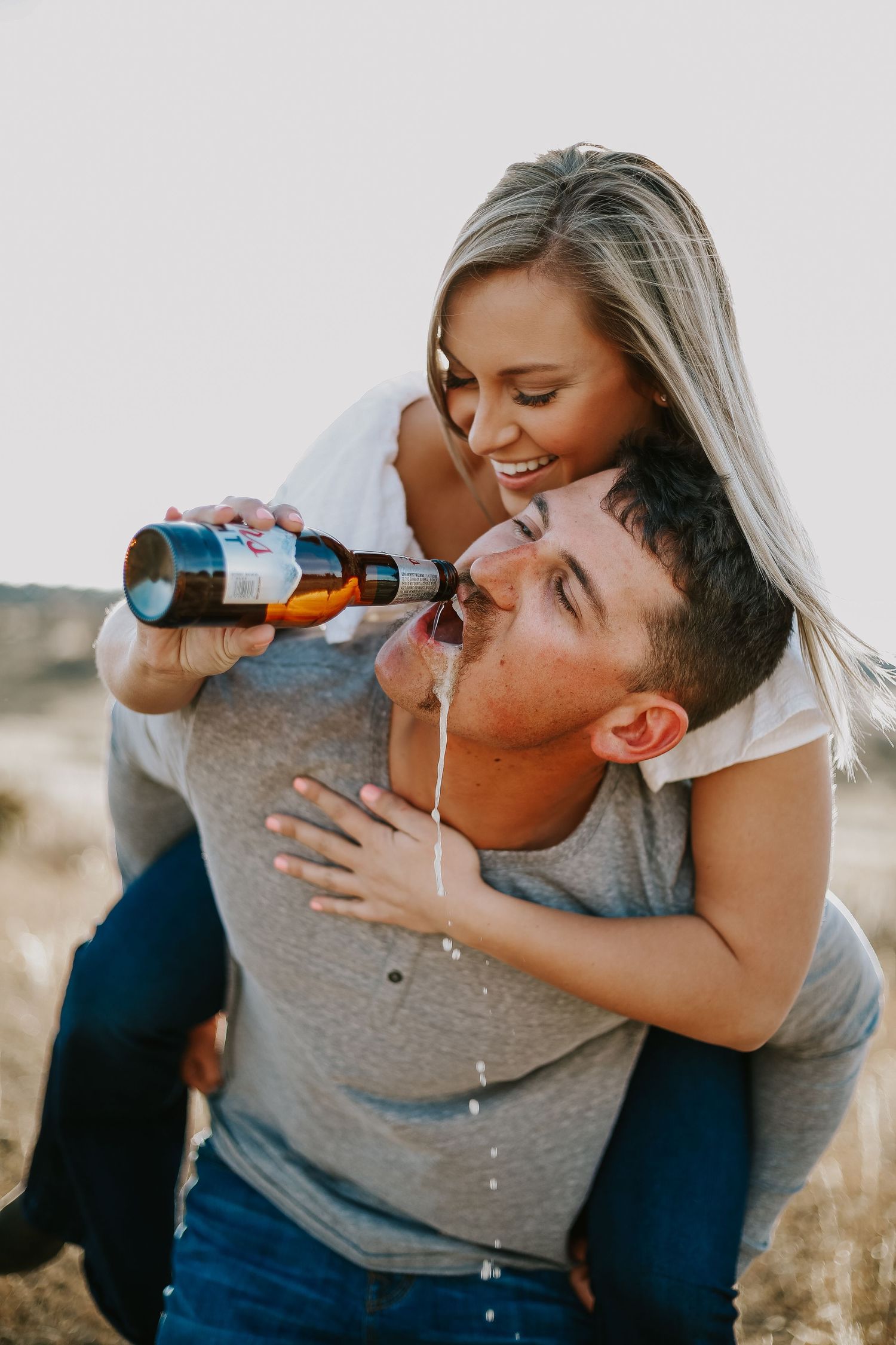 Couples photo shoot with beer.
