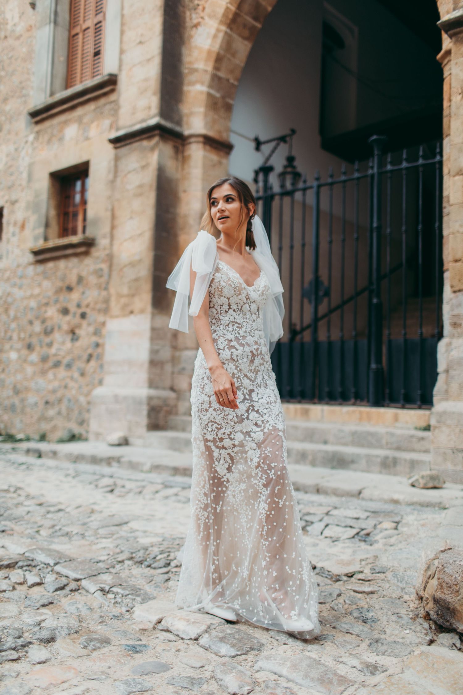 Gorgeous bride from Ukraine getting married in Mallorca, Valldemossa, wearing a lace dress