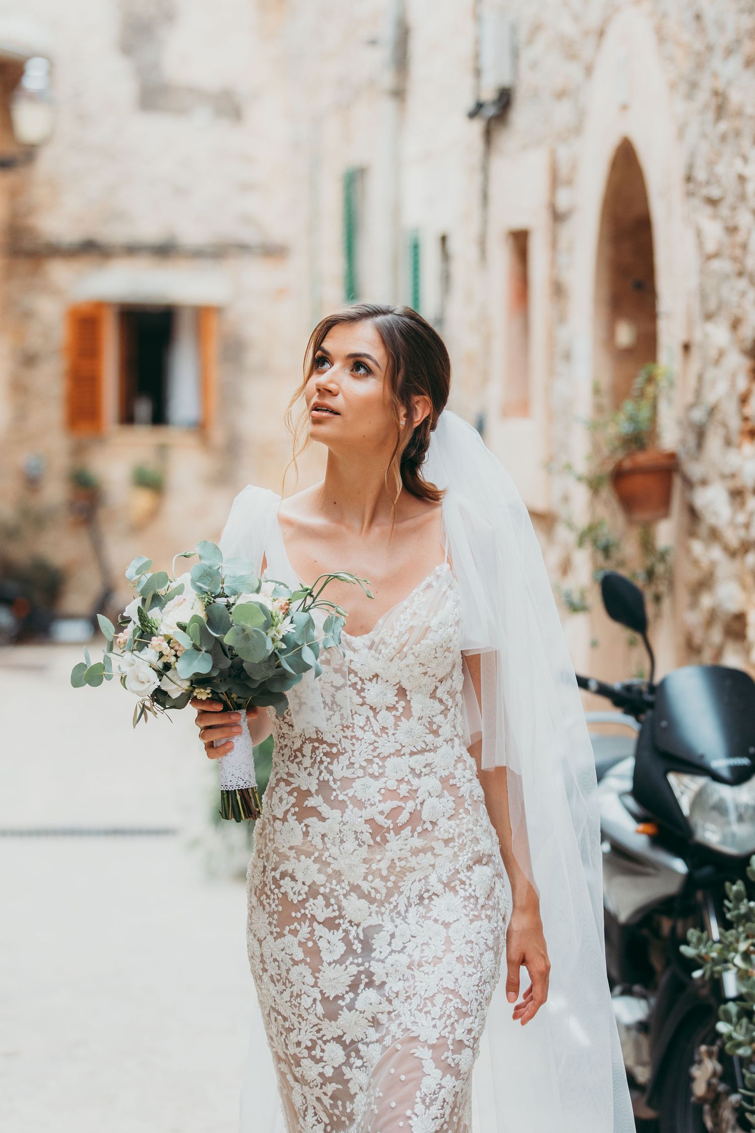 Gorgeous bride wearing a lace dress in Valdemossa, Mallorca, lace-wedding-dress