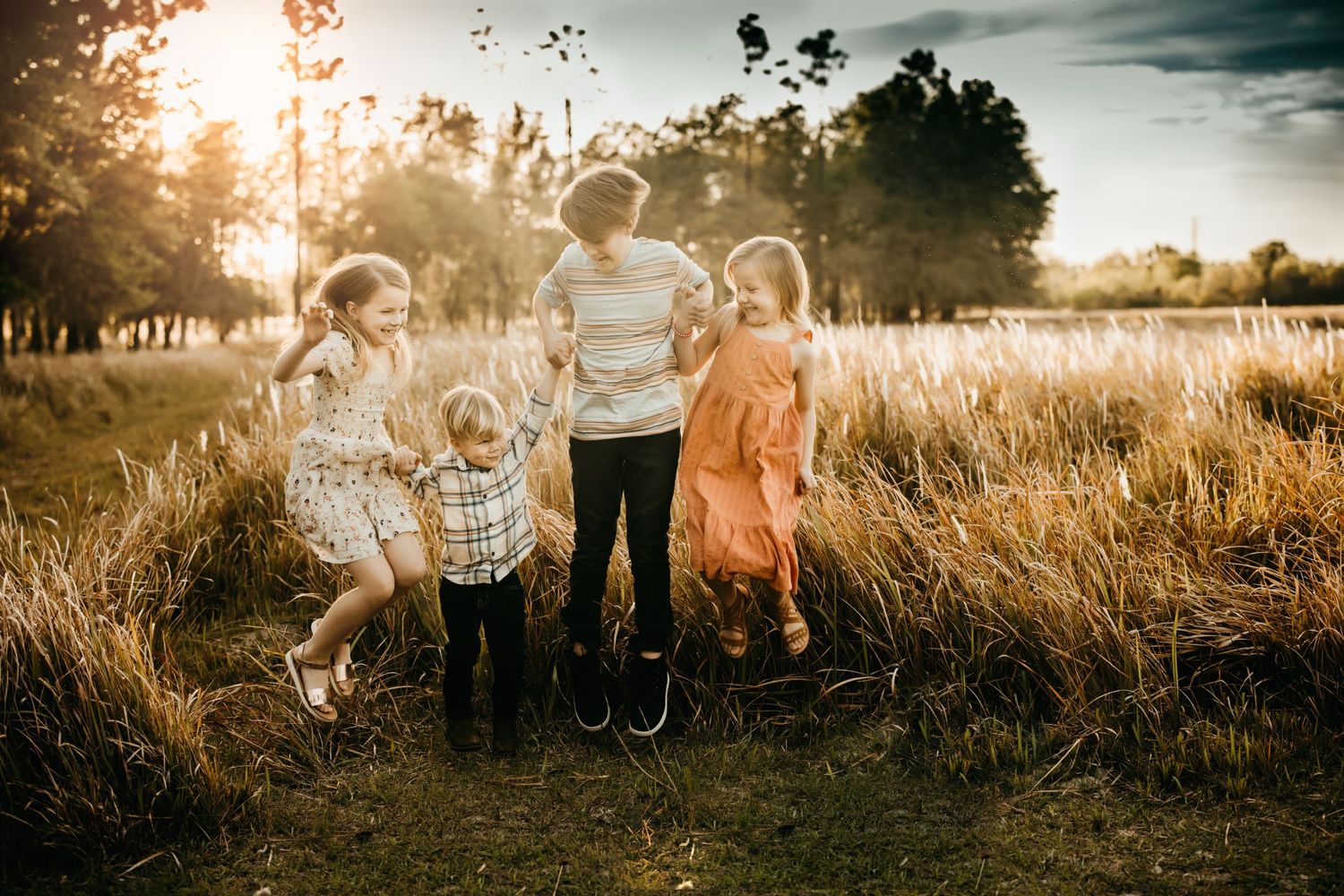 Lakeland Family Photographer- Kids jumping holding hands