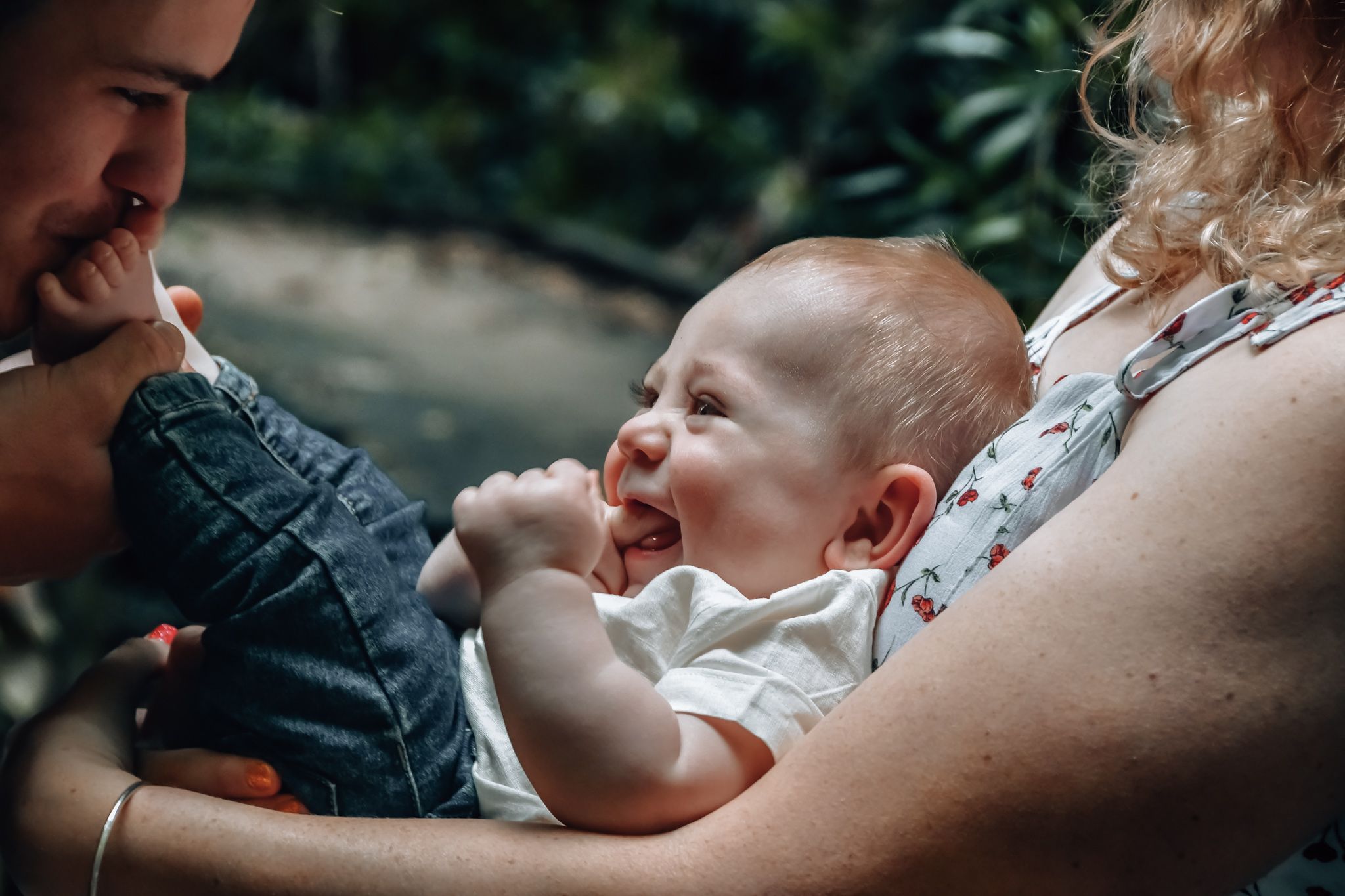 Intimate family moment captured in moody natural lighting.