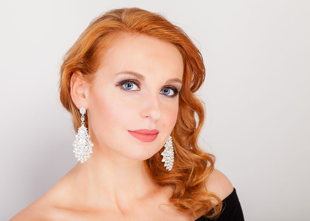 Glamour portrait series featuring vintage-inspired styling with dramatic makeup and jewelry.