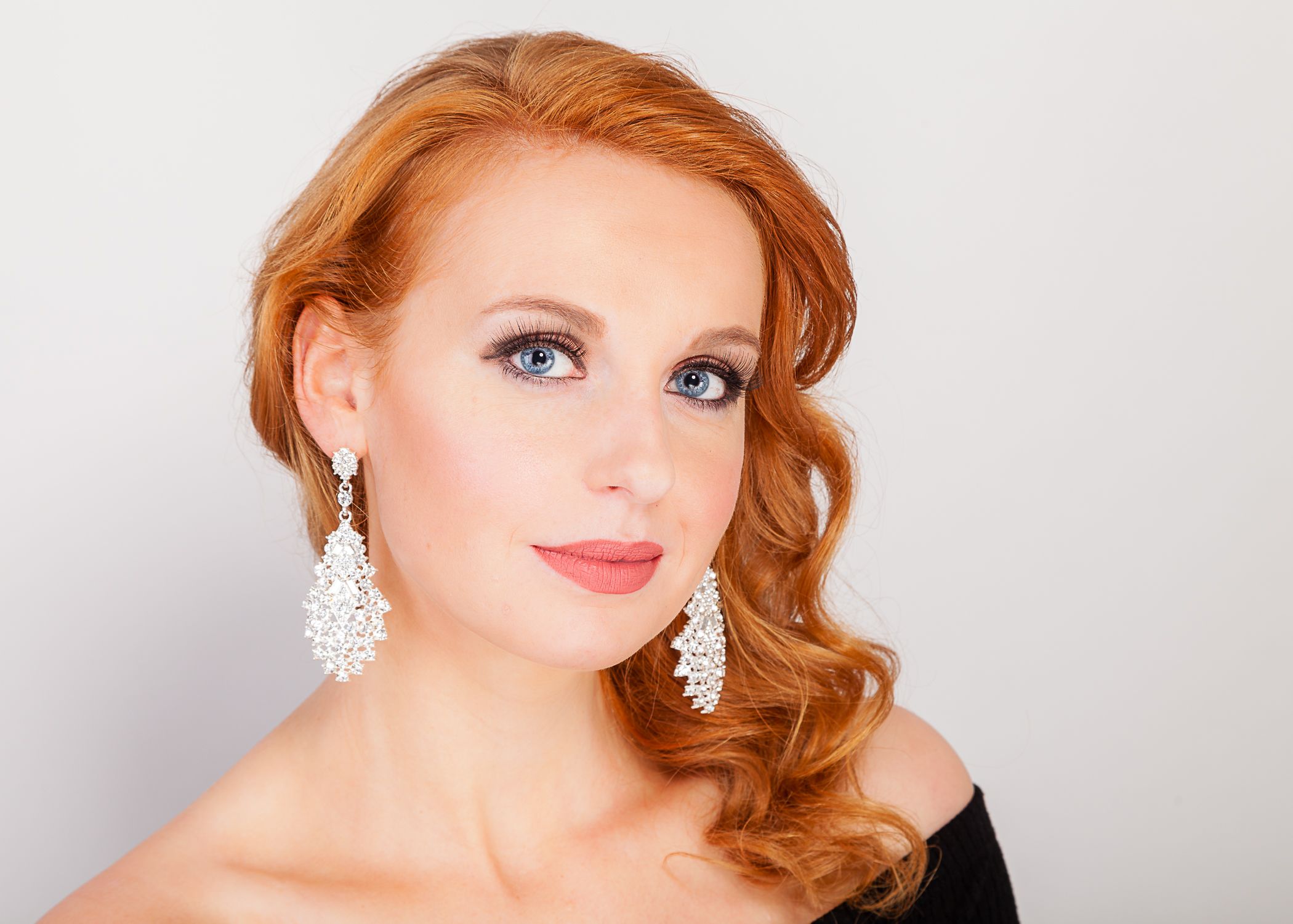 Glamour portrait series featuring vintage-inspired styling with dramatic makeup and jewelry.