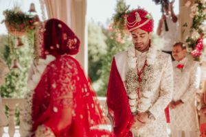Wedding ceremony moment capturing traditional Indian bride and groom during their ritual.