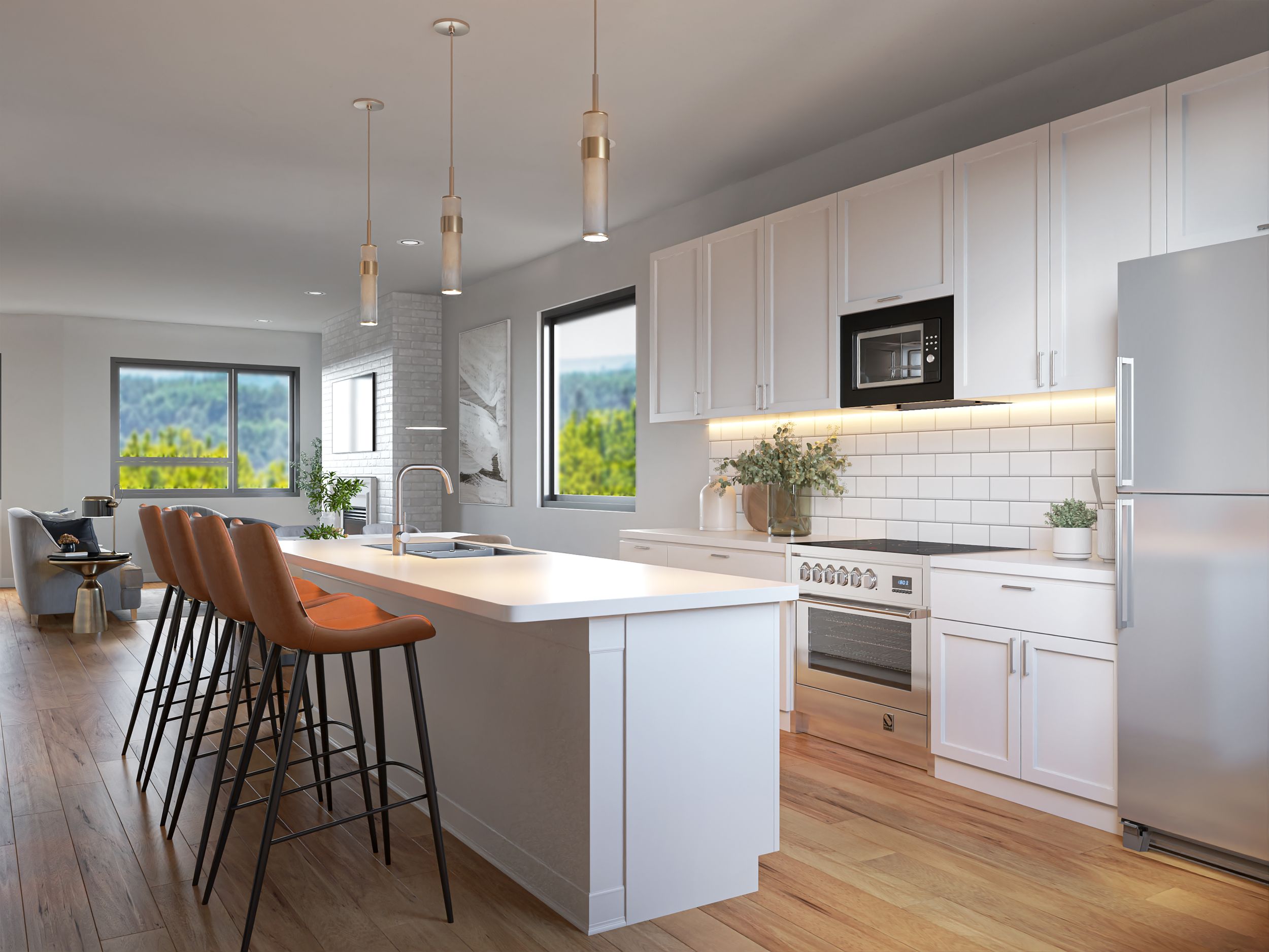 Contemporary white kitchen with island seating, pendant lights and light wood flooring.