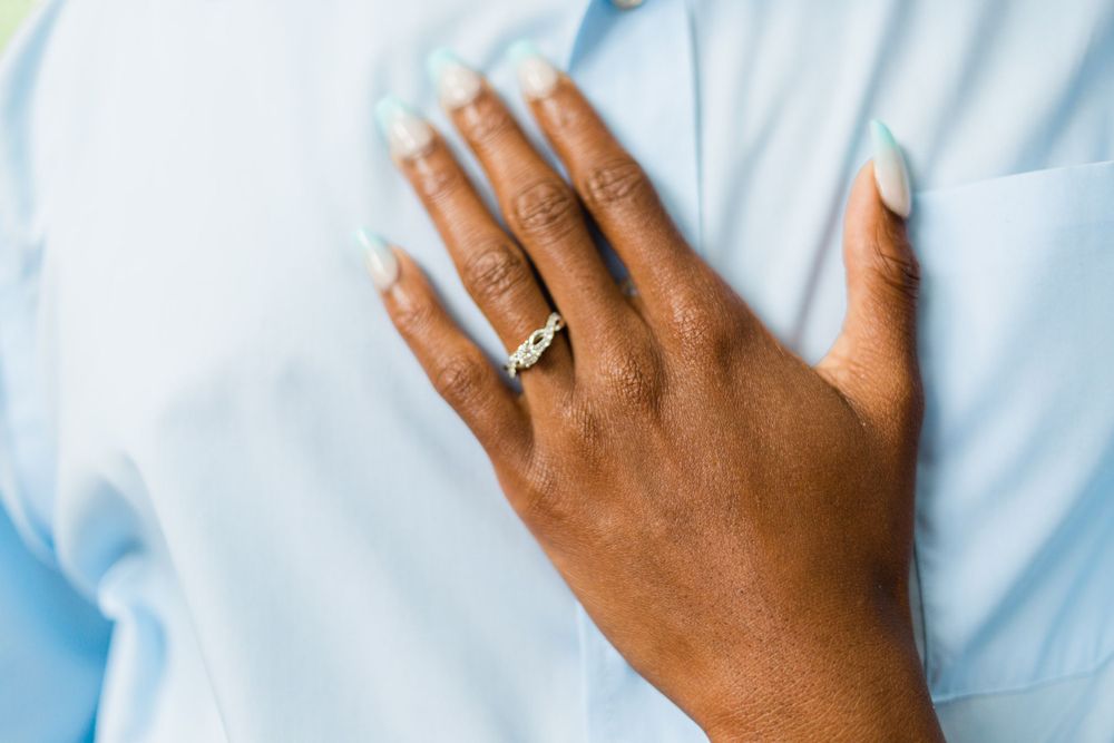 Woman's hand on blue shirt showing engagement ring Callaway Gardens, GA