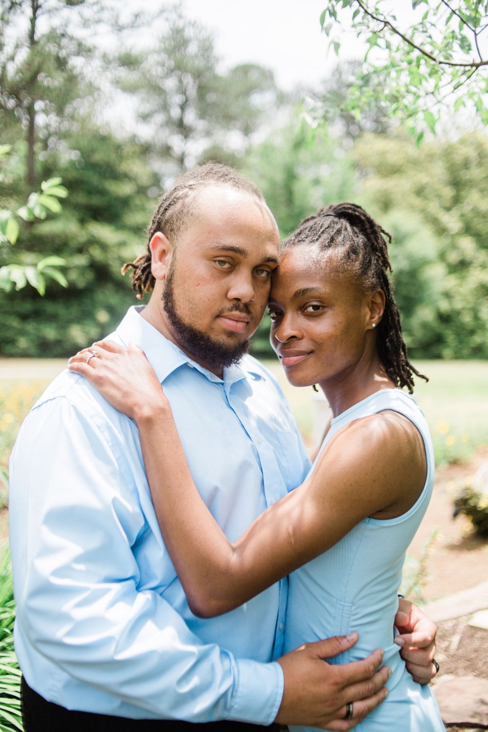 Couple smiling at camera in front of Callaway Garden's butterfly pavilion