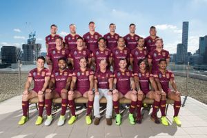 Rugby league compact team photo with city skyline background