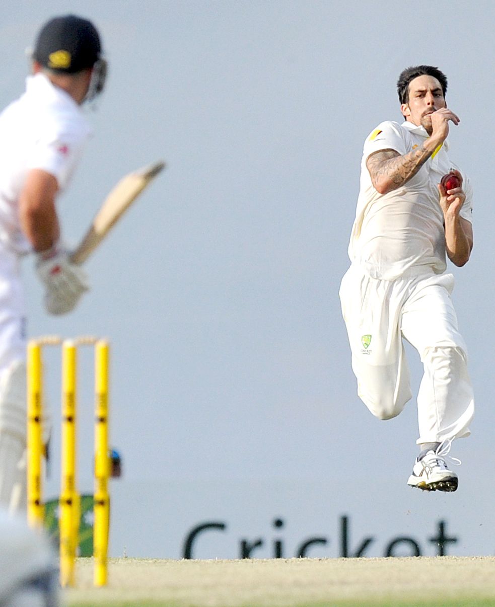 Cricket bowler running in to bowl the ball
