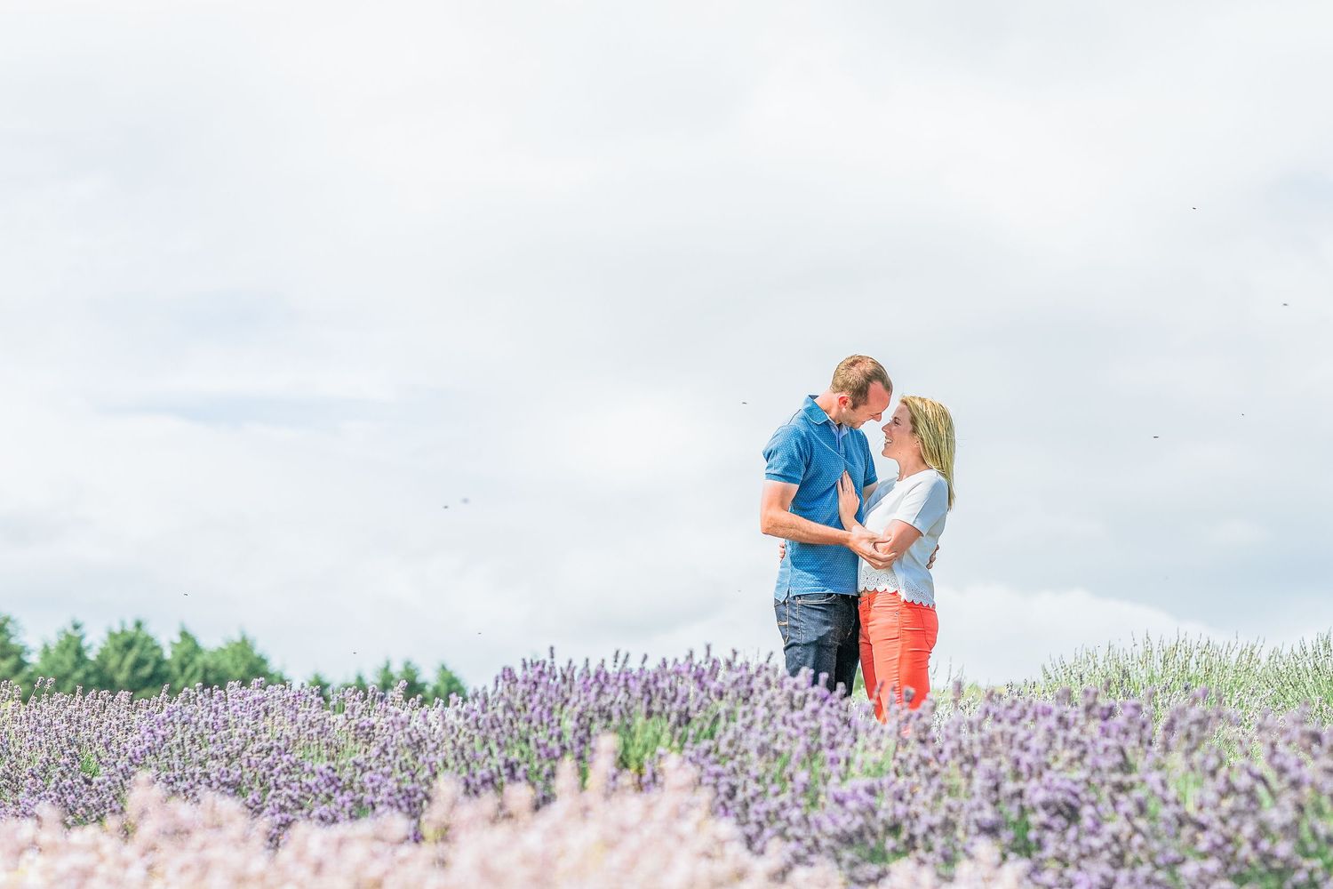 Hayley Elizabeth Photography Cotswolds Photographer Lavender engagement session Snowshill couple stood about to kiss