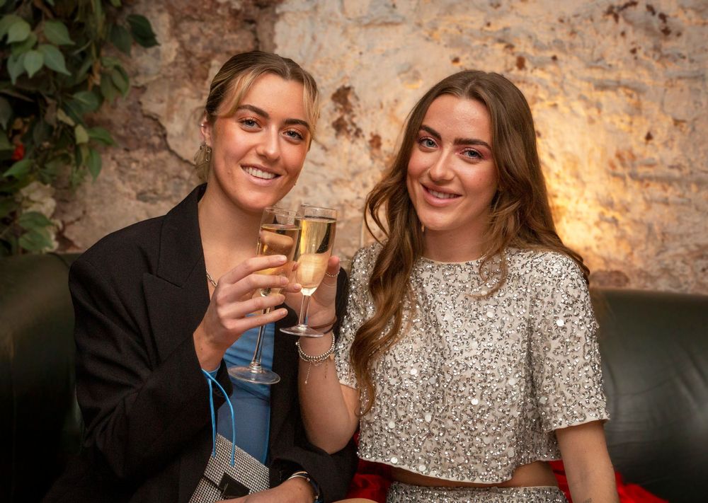 Girls cheers at party.