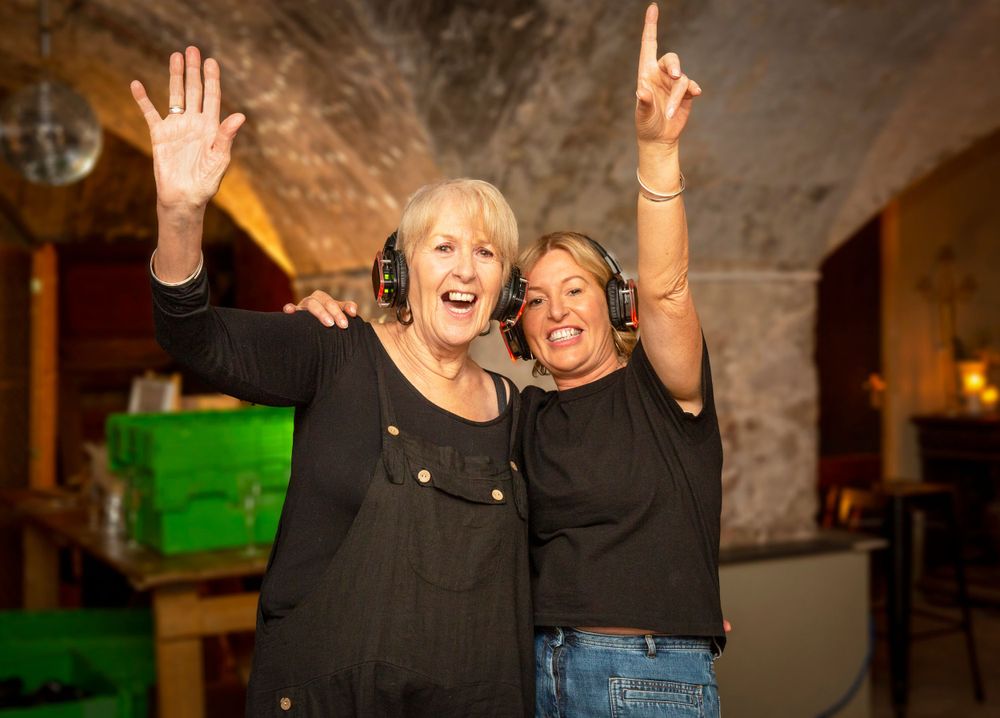 Silent disco. party guests. Girls dancing.