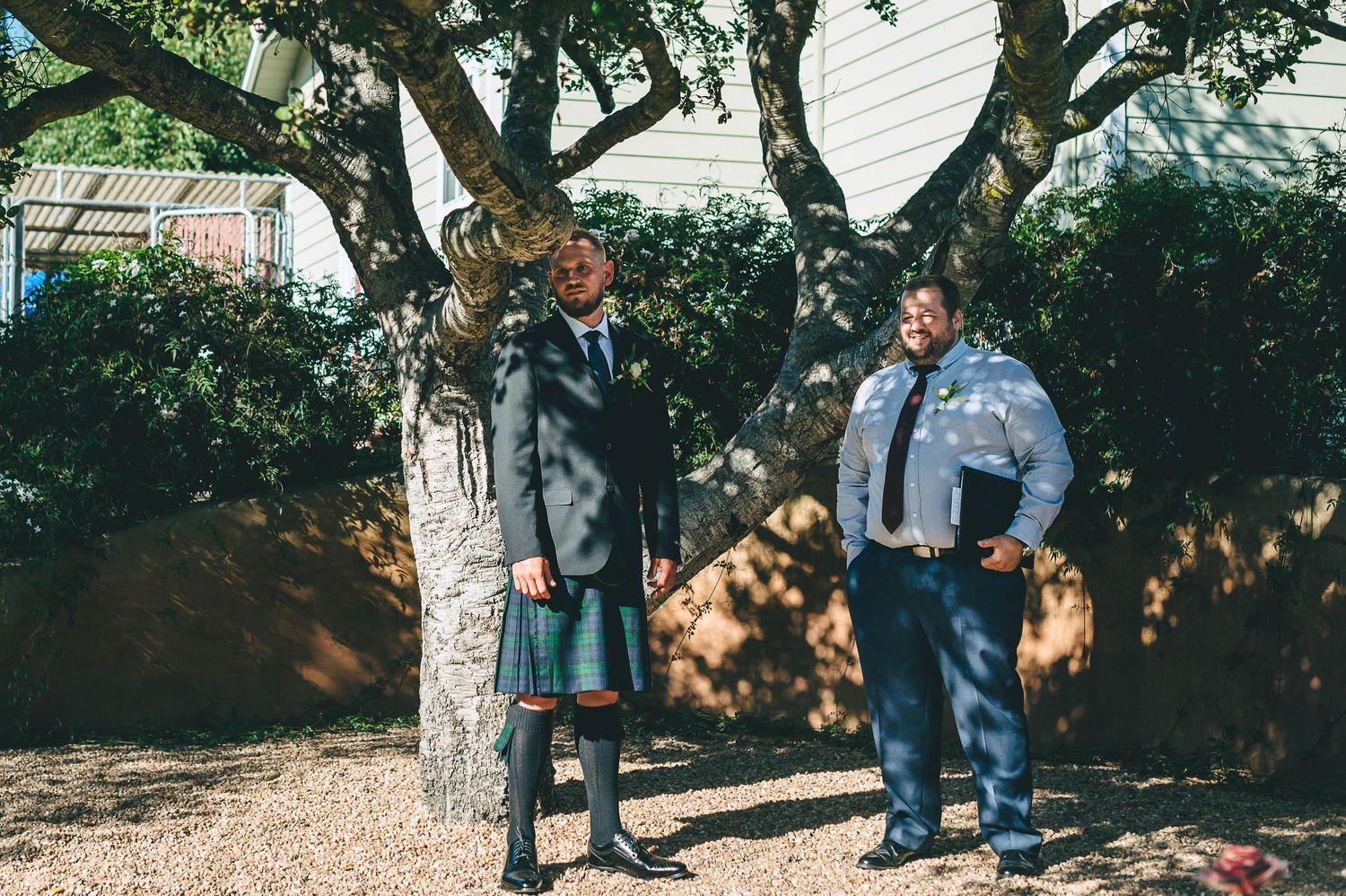 Groom wearing a kilt waiting for his bride