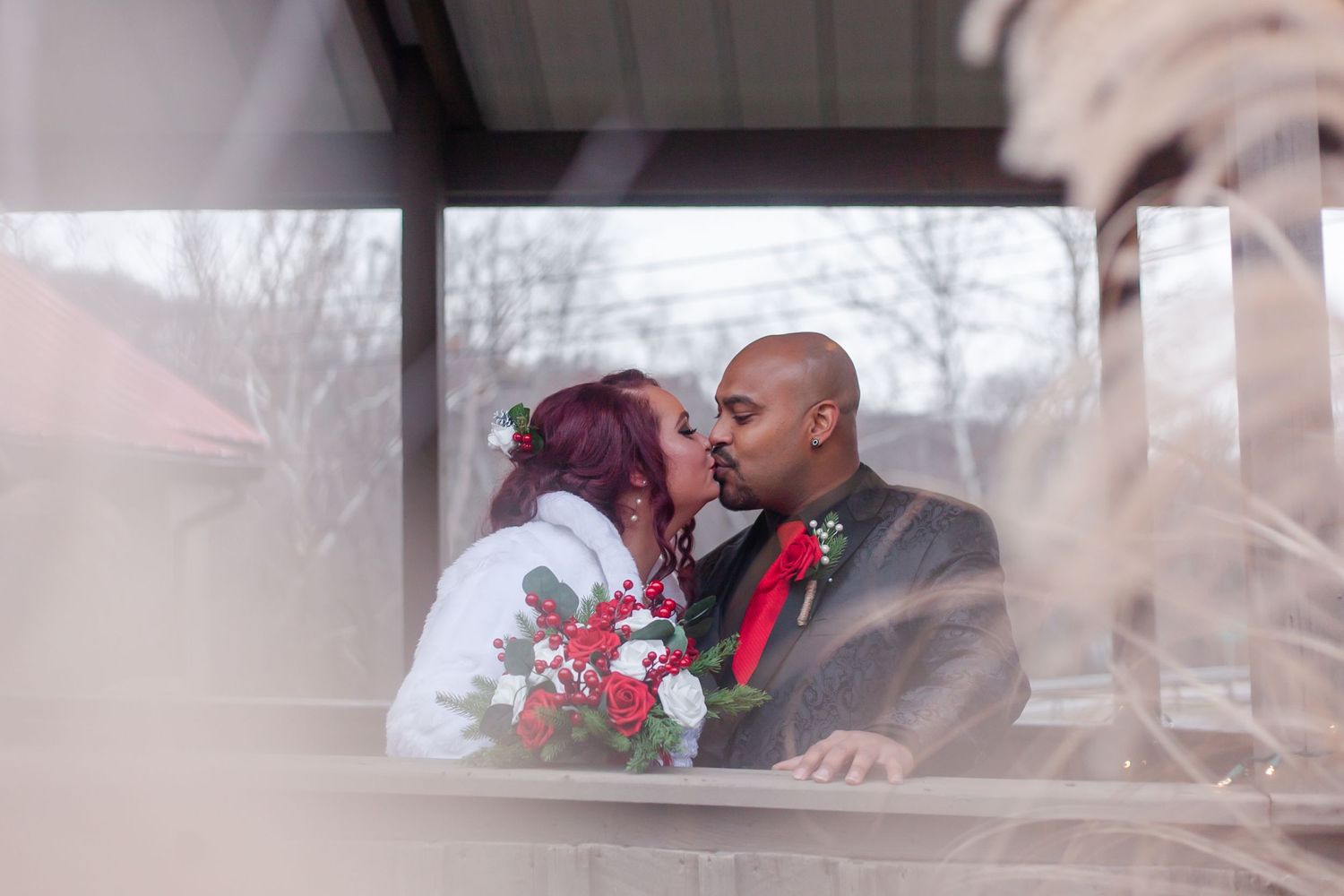 A couple shares a tender moment during their winter wedding celebration.