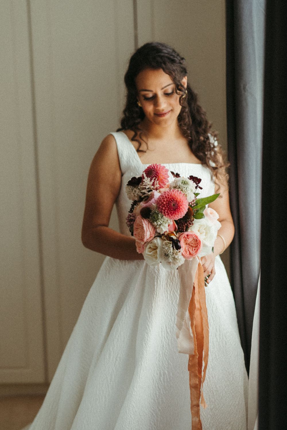 A close-up shot of a bride holding a beautiful pink and white bouquet. London Wedding.