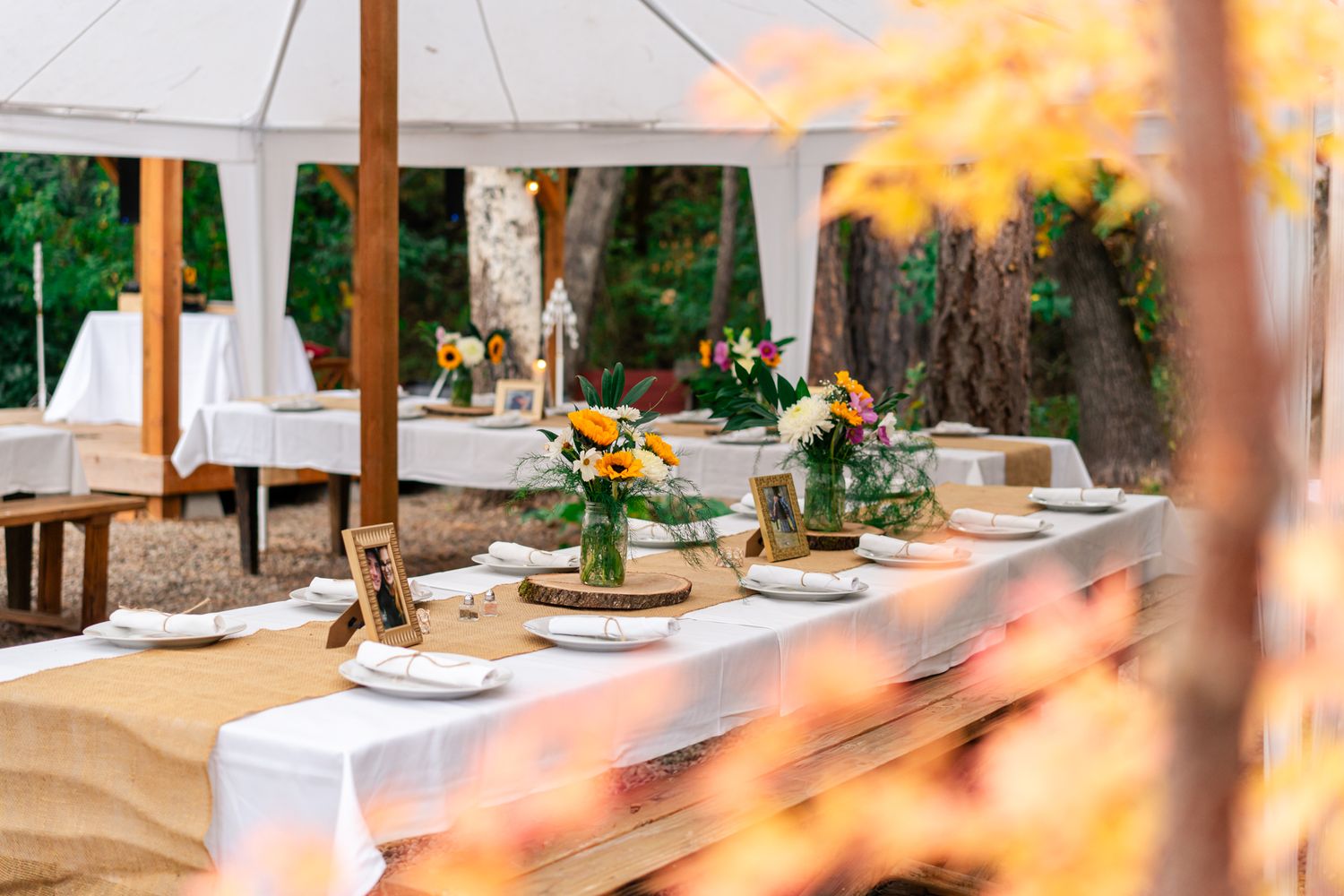 reception set up with tables and flowers