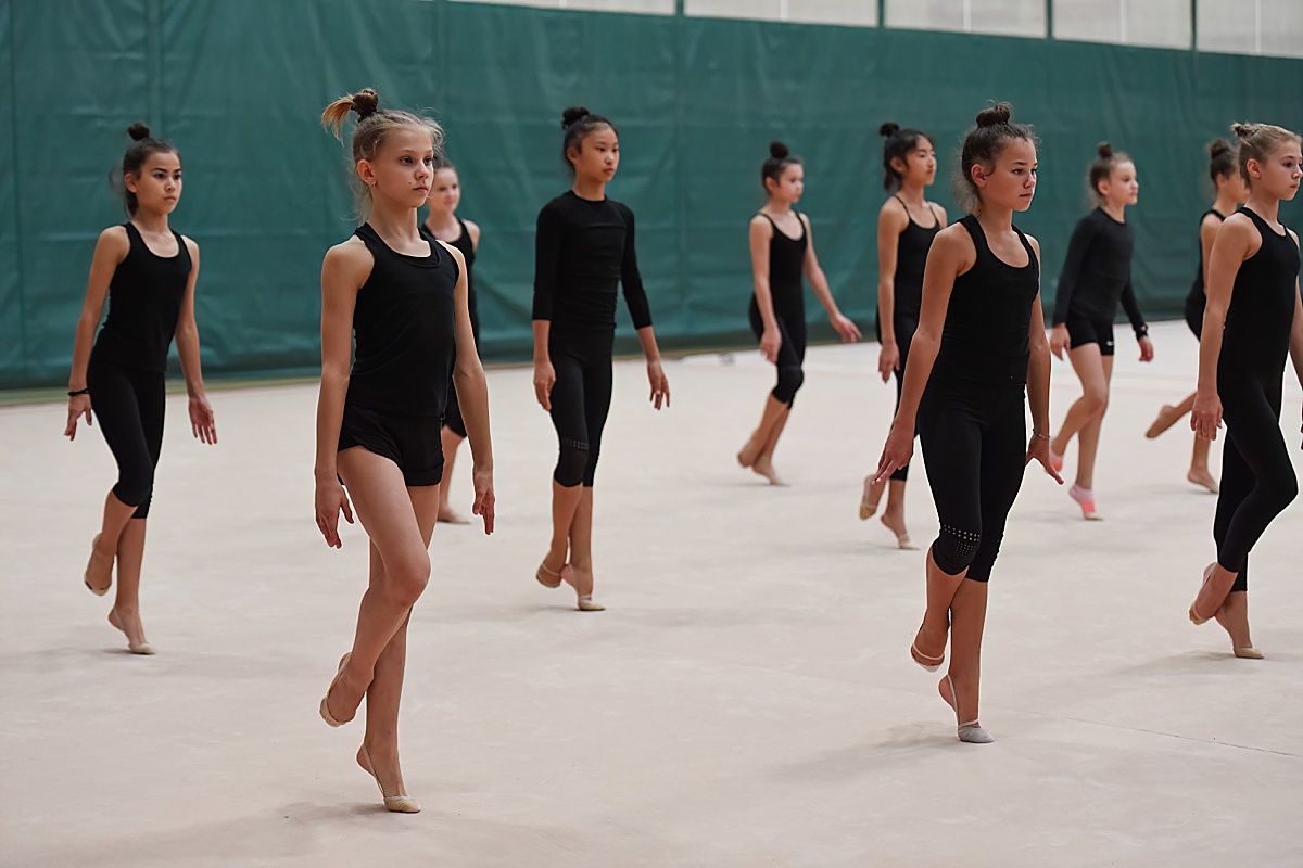 Rhythmic gymnasts releve at Olympic Training Center
