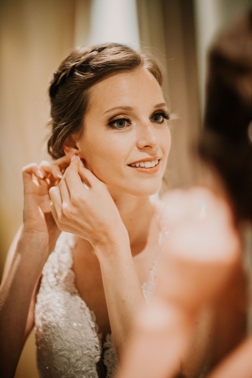 Wedding day preparation showing elegant hair and makeup styling.