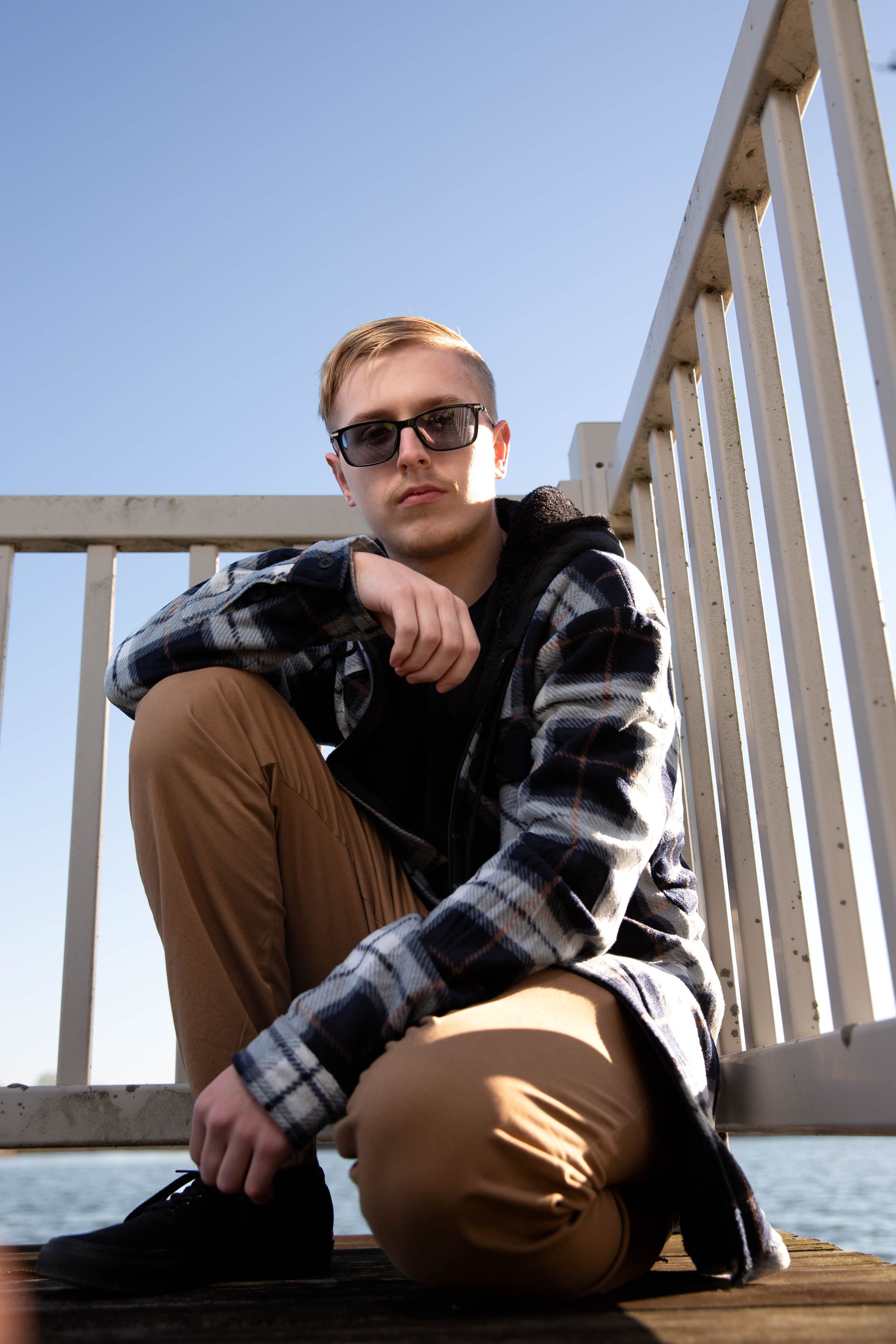 Senior boy pose from low angle
