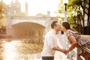 A young couple kissing by the Rideau Canal