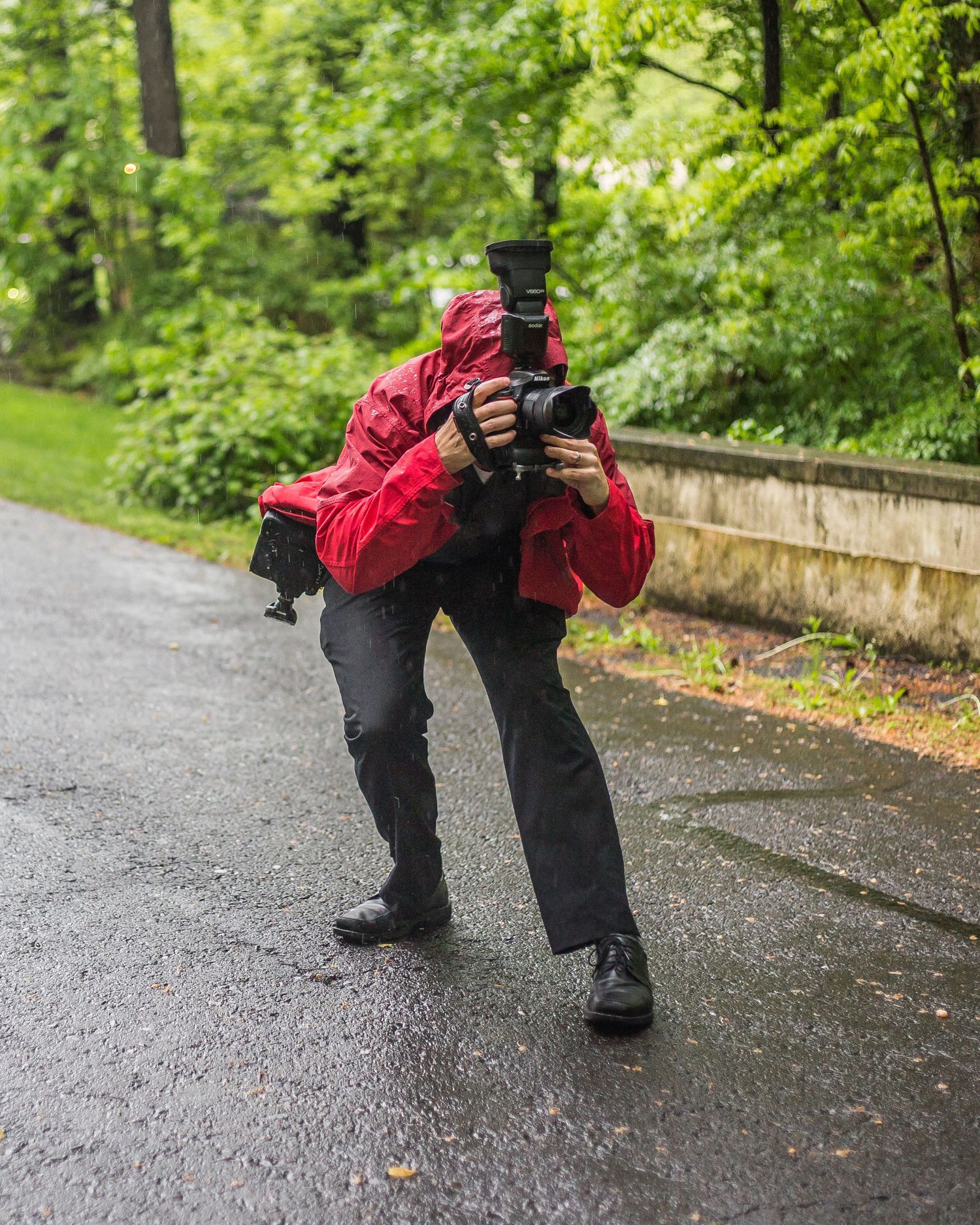 a wedding photographer in the rain