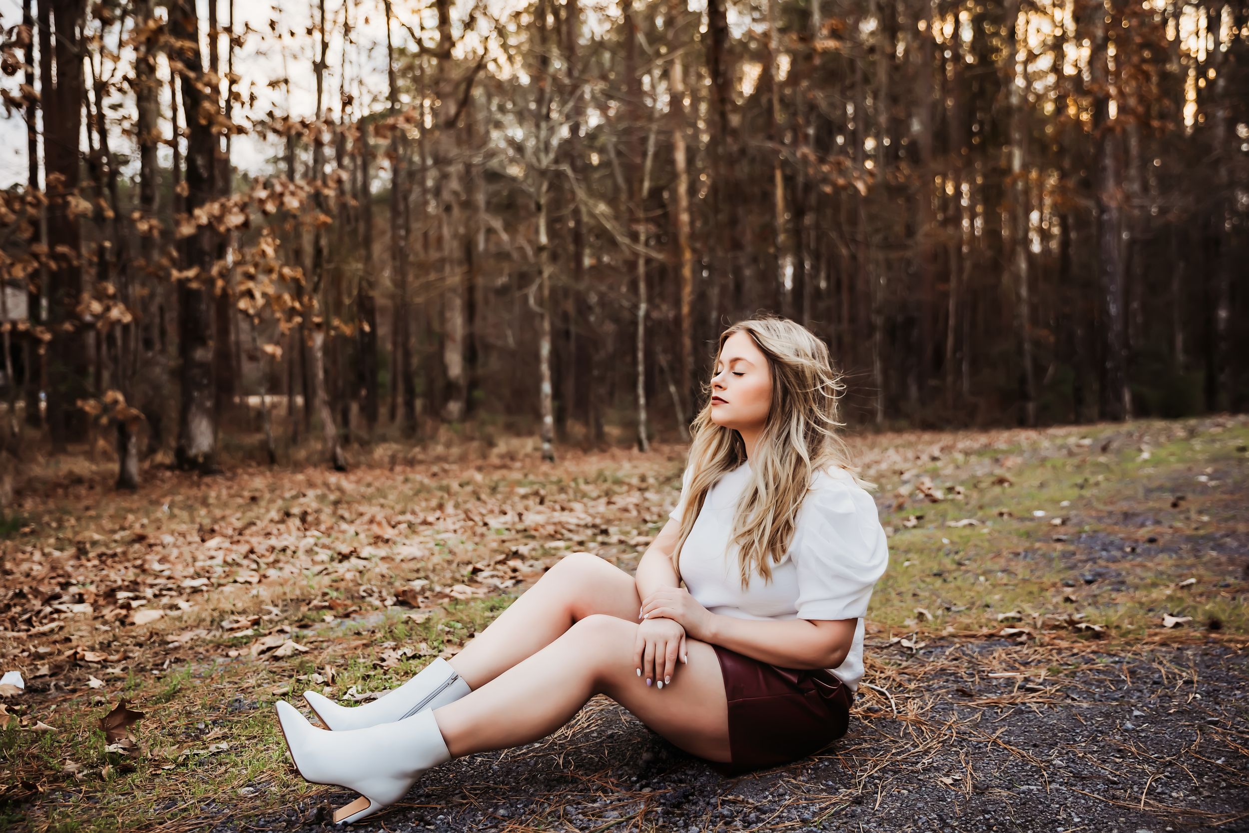 Casual outdoor portrait session in a wooded area during autumn.