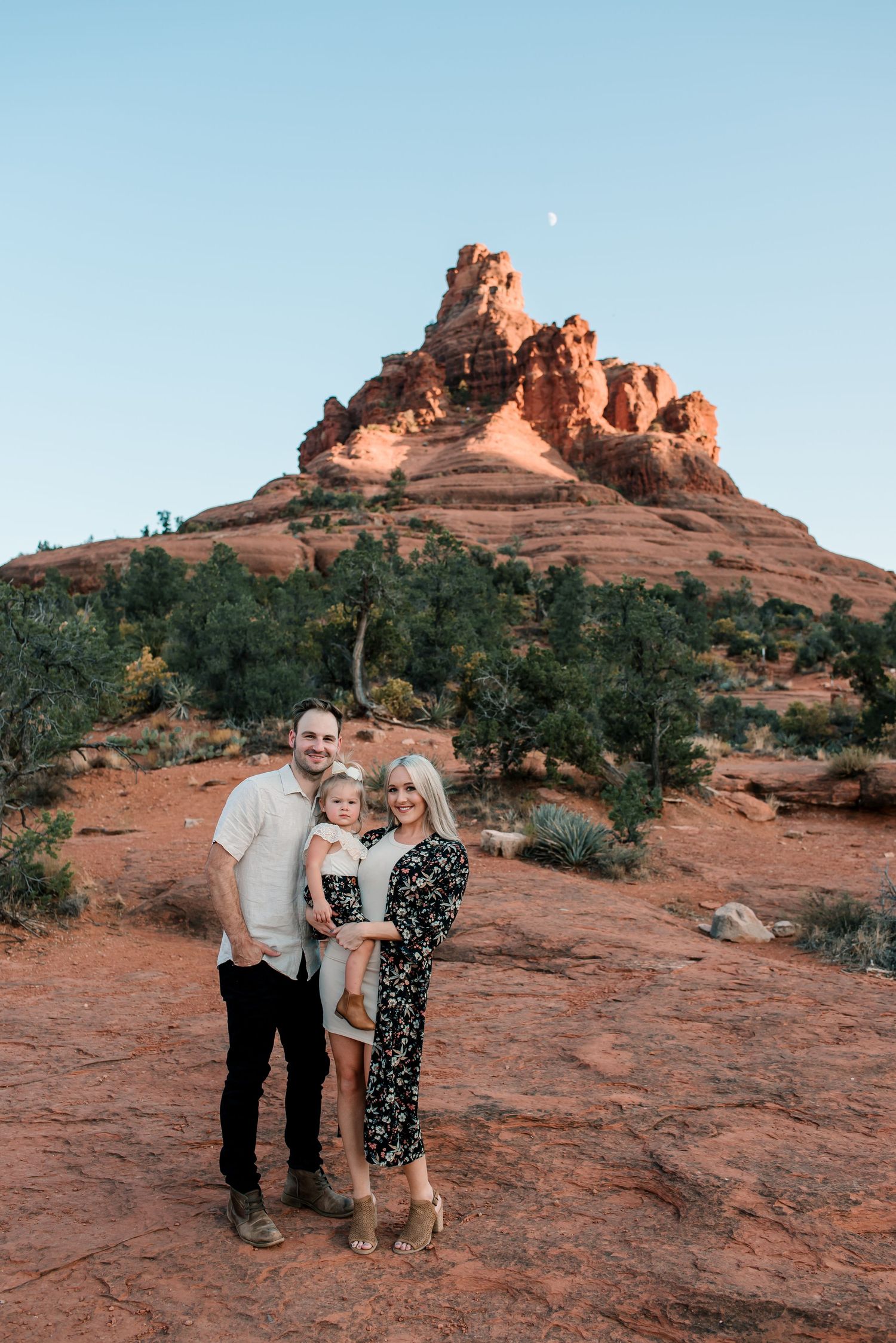 A scenic photo at Bell Rock in Sedona showing a red sandstone formation against a blue sky.