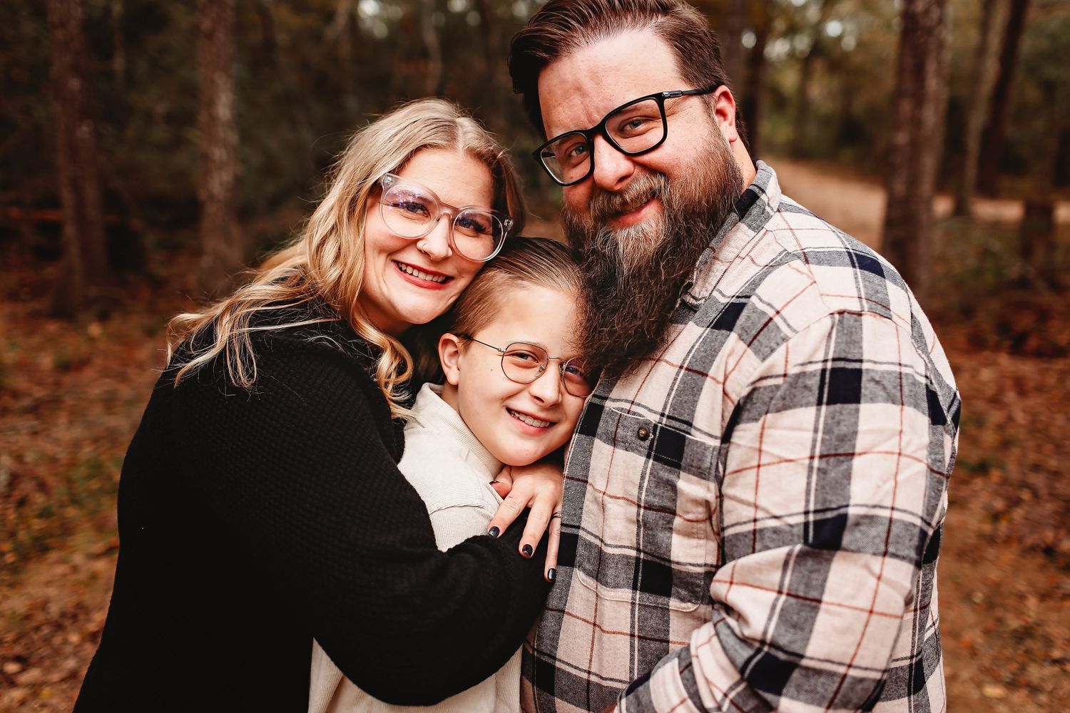 Mom and dad hugging their son at Camp Mohawk Alvin, Tx