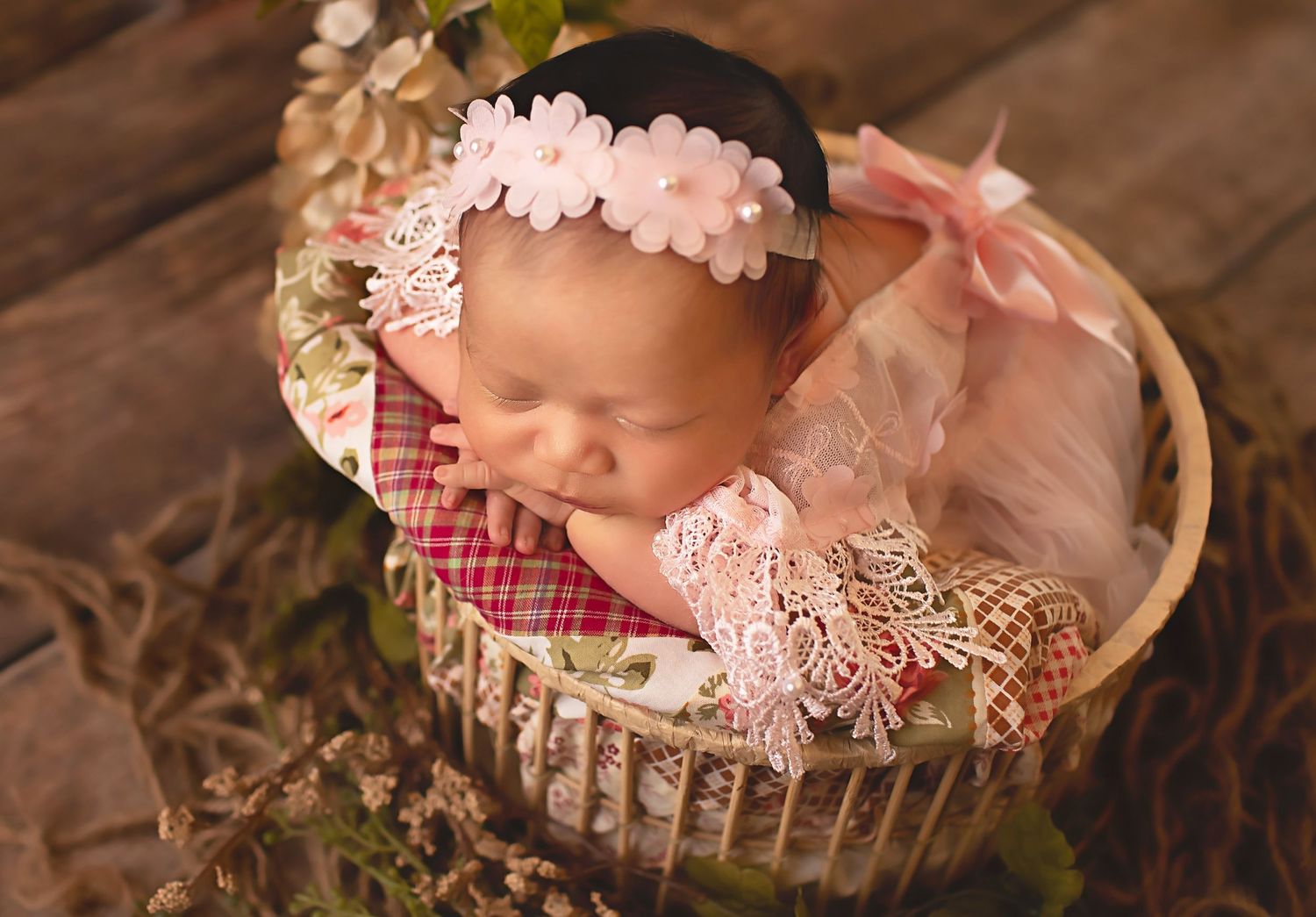 Baby girl wearing pink in basket in Friendswood Tx maternity and newborn packages Houston
