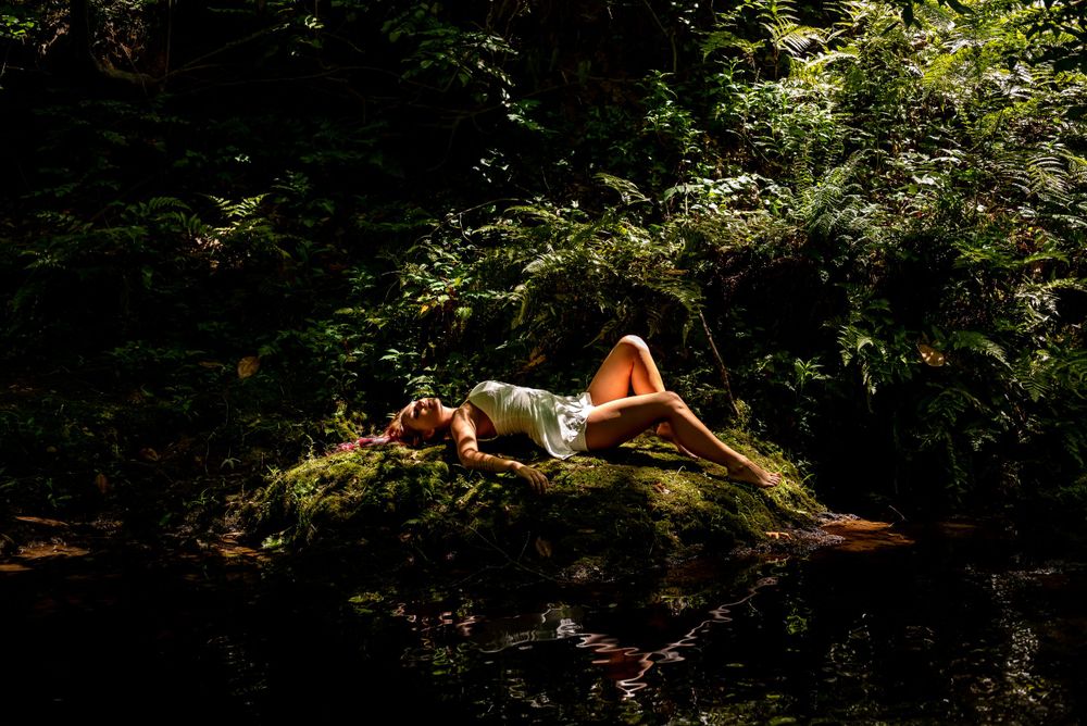 outdoor portrait of woman by creek, empowering session