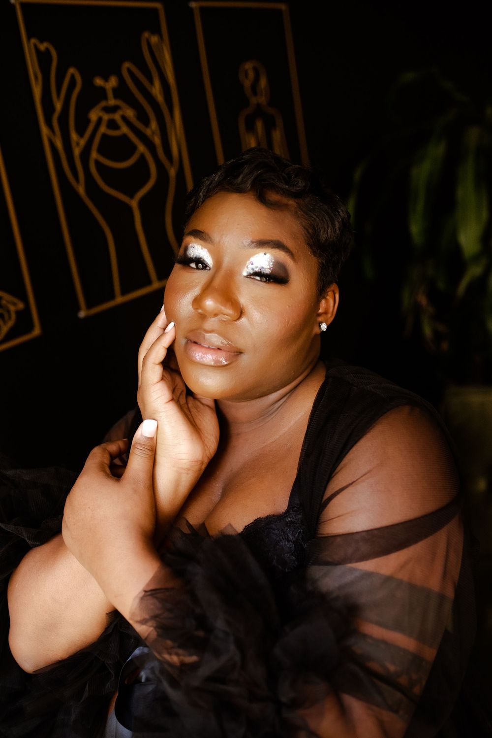black woman maternity session up close portrait black wall natural light studio