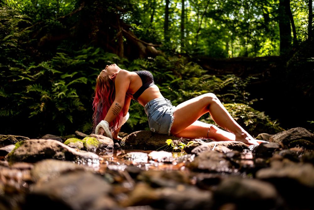 outdoor portrait of woman by creek, empowering session