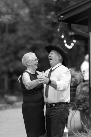 Wedding couple dancing together on their wedding day.