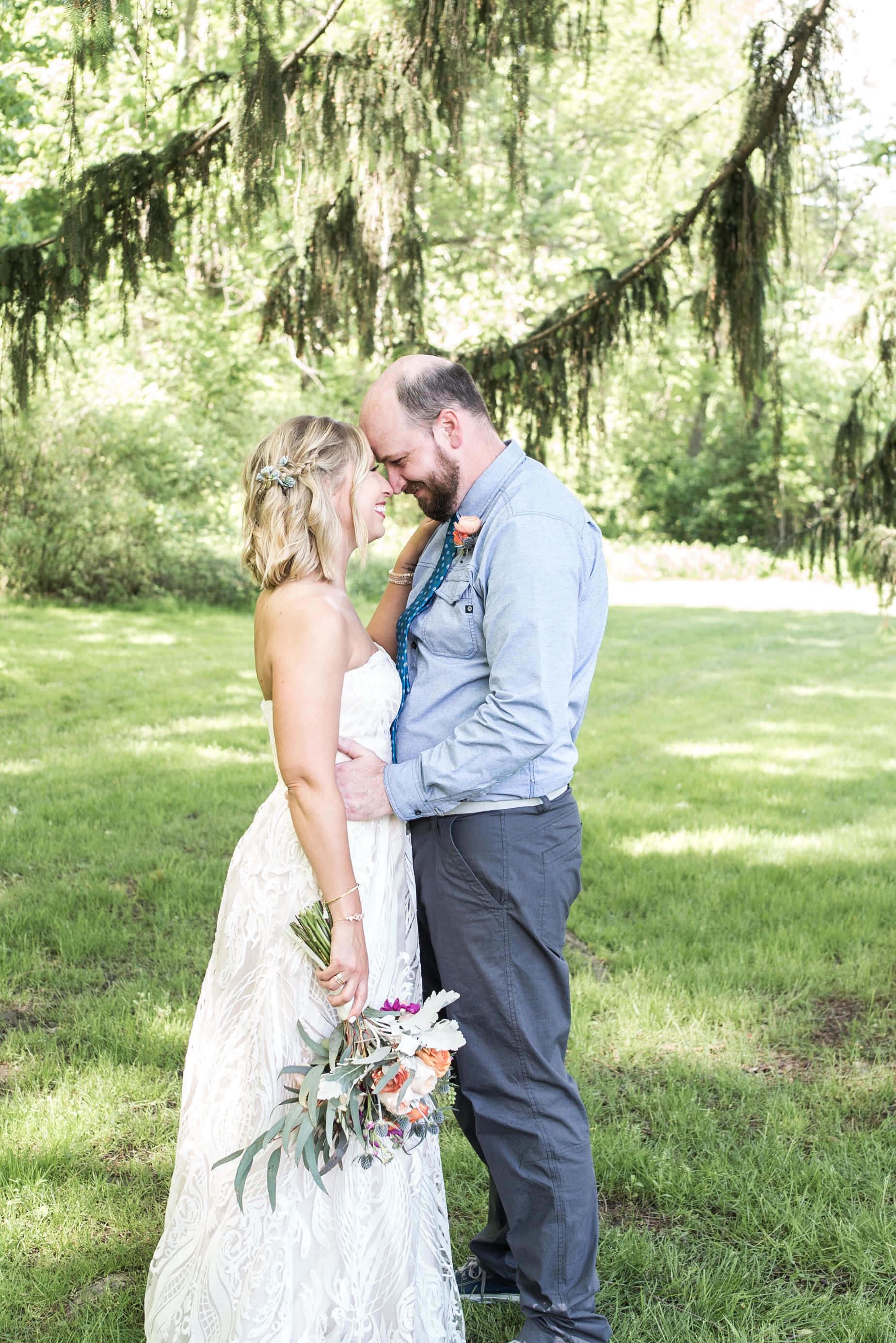 First Look Photos Bride and Groom. Downtown Grand Rapids Wedding Portraits. John Ball Zoo Weddings. Wedding Photography.