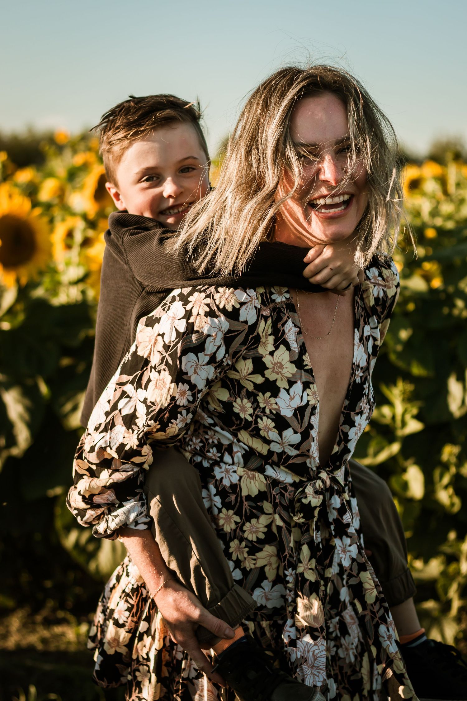 Fun family photos at sunflower fields in Bowden Alberta near Calgary by Love & Sunshine Photography