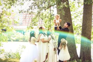 Beautiful large family photo taken in Highland Park, NJ by a professional lifestyle photographer with a natural rainbow