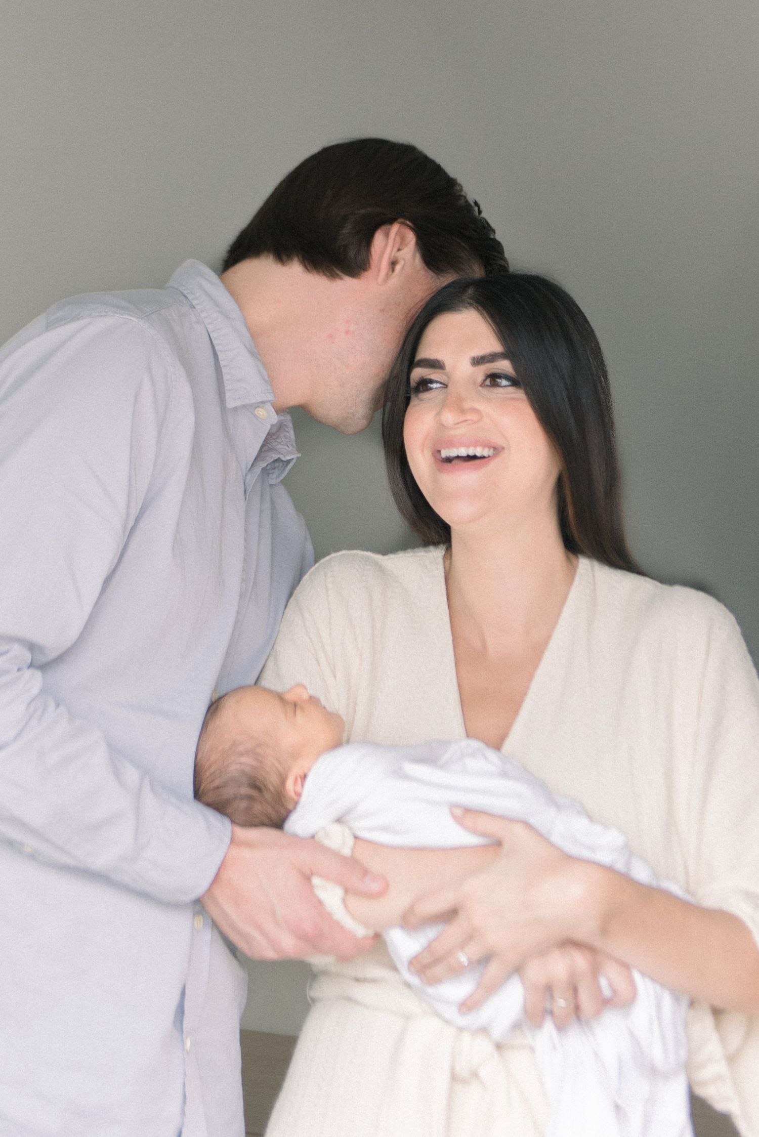 mom laughing at Washington DC Newborn session